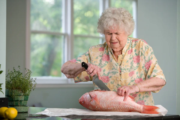 Caregiver assisting a senior patient with mobility and daily care